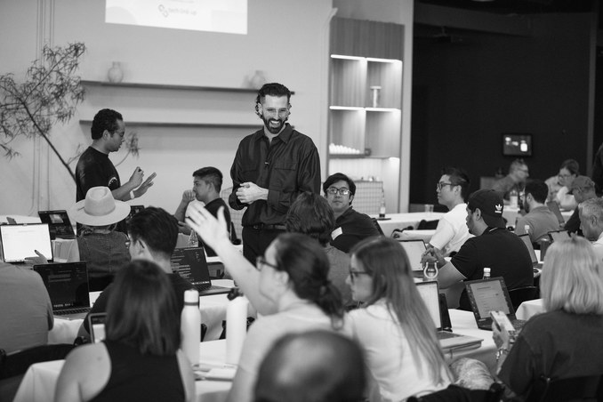 Attendees working together at a Claude workshop in Orange County.