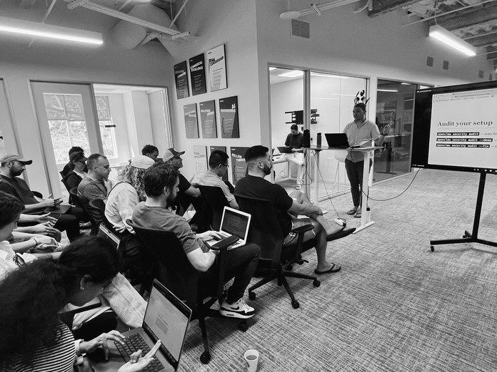A full room at a Claude Impact Lab